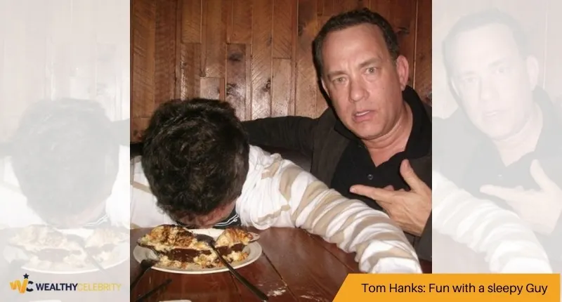 Tom Hanks with a sleepy Guy - photo bomb